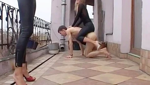 Two Dominant Goddesses Humiliate Their Skinny Foot Slave On The Balcony